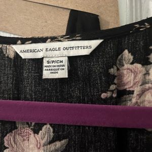 Long sleeved Dark floral romper with Flared out sleeves